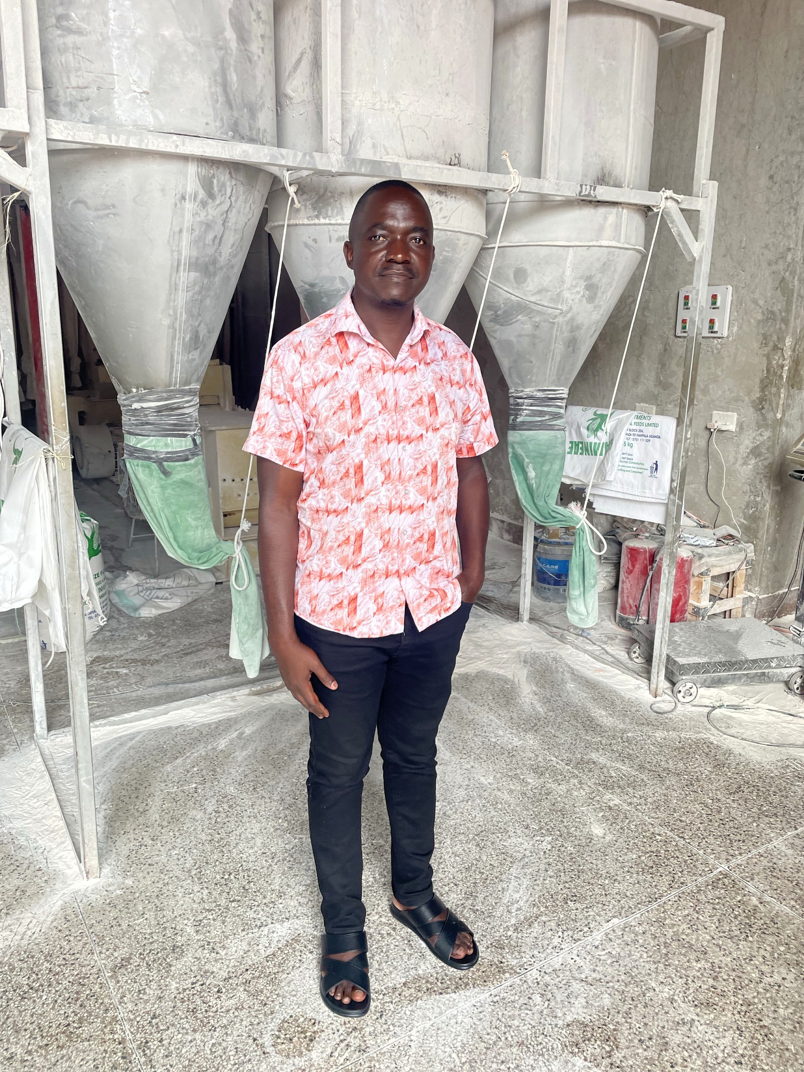 Nunda William at maize processing equipment